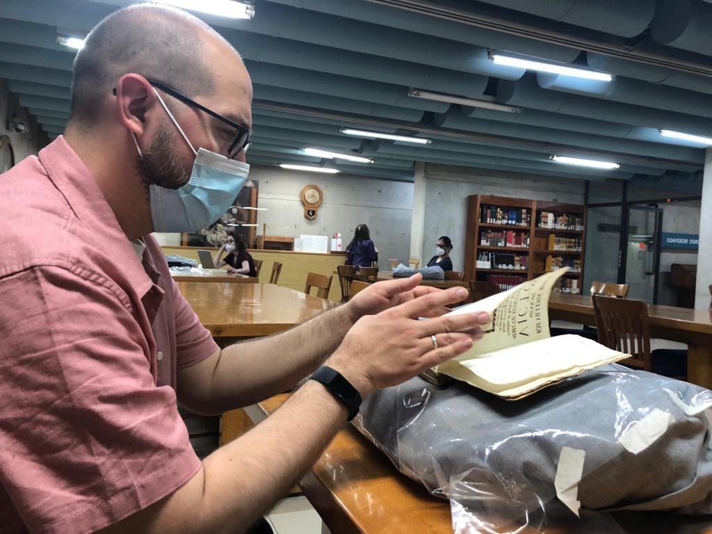 Professor Hartman examining ancient text